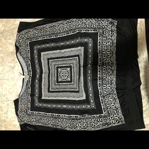 Black and white  no sleeves silk blouse.